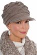 Middle age woman wearing beige cancer hat with brim and pleating