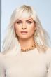 Woman in a past the shoulders medium brown blunt cut wig with blunt bangs