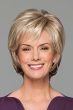 Woman in blonde, cropped bob wig with longer layers at the back and a side part