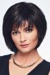 Woman in a past the chin length black blunt bob wig with fringe bangs