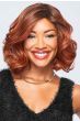 Afro American woman in a shoulder length reddish brown curly wig