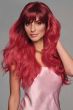 Woman in an extra long hot pink layered wig with fringe bangs