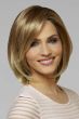 Woman in a blonde shoulder length layered bob wig