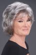 Woman in a light brown chin length lace front bob wig with extra volume along the forehead