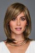 Shoulder-length layered wig with side-swept bangs and highlighted strands, styled smooth with flipped ends