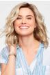 Woman in a petite shoulder length light blonde curly lace front wig