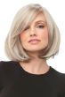 Woman in a chin length platinum blonde blunt bob wig with long side bangs