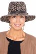 Woman in leopard print winter fedora hat with leather band and buckle accents