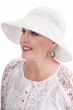 Woman in white woven summer sun hat with wide brim