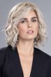 Woman in a 6.5" to 11" curly light blonde hair topper for thinning hair