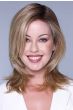Woman in a shoulder length medium blonde wig with long layers