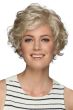 Woman in a long curly dark blonde layered pixie wig