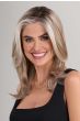 Woman in a past the shoulders light blonde lace front wig with long layers