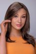 Woman in an extra long dark brown lace front wig with long feathered layers