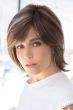 Woman in a shoulder length medium brown bob wig with side bangs and long layers