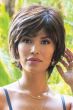 Woman in brown short, straight layered wig with bangs