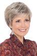 Woman in short blonde rooted pixie wig with bangs