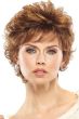 Woman in a long curly light auburn pixie wig with longer layers on top and side fringe bangs