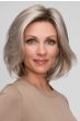 Woman in a petite shoulder length light brown lace front bob wig