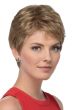 Woman in a petite short layered dark blonde pixie wig