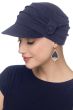 Woman wearing navy cancer hat with multiple pleats and side button
