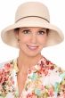 Woman in off-white finely woven wide brim outdoor summer sun hat that flips up or down