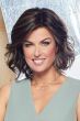 Woman in a wavy shoulder length dark brown lace front wig