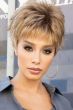Woman in blonde short spiky pixie cut wig with bangs