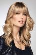 Woman in a 9.75" warm blonde hair topper with 6" fringe bangs