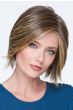Woman in a chin length light brown angled lace front bob wig