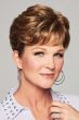 Woman with a dark ash blonde short hair topper with fringe bangs