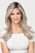 Woman in an extra long warm blonde lace front wig with dark roots