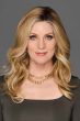 Woman in a 14" wavy blonde lace front hair topper for thinning hair
