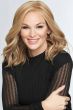 Woman in a past the shoulders curly warm blonde lace front wig