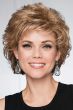 Woman in a short light brown bob wig with curled layers and fringe bangs