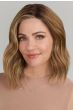 Afro American woman in a chin length medium brown wavy lace front wig