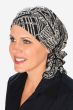 Woman in pre tied head scarf for cancer patients in black and beige print
