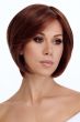 Woman in a chin length light blonde rounded bob wig