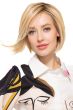 Woman in a chin length light blonde rounded bob wig