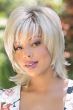 Afro American woman in a shoulder length platinum blonde wig with choppy layers and bangs