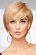 Woman in a long reddish blonde pixie wig with side bangs