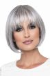 Woman in a blunt chin length grey wig with fringe bangs