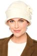 Woman in cream cloche hat with flower on the side