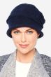 Woman in blue cloche style hat for cancer patients with textured fabric and side flower