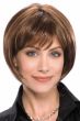 Woman in an ultra petite chin length medium brown rounded bob wig with fringe bangs