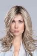 Woman in a large past the shoulders ash blonde
wavy lace front wig