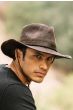 Man outdoors in distressed brown australian outback hat