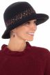 Woman in cute fall and winter black bucket hat with colorful accents for cancer patients