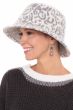 Woman in grey and white leopard print winter cloche or bucket hat for women