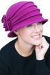 Woman in wool felt cloche winter hat with brim, pleating and flower on the side